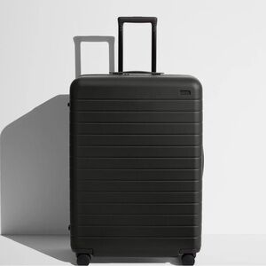 Away large black suitcase in like new condition with storage bag